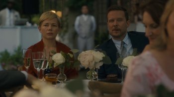 Movie still from “After the Wedding” (2019), directed by Bart Freundlich – A man and a woman sitting at a dinner table; Close Up shot, Over the shoulder angle