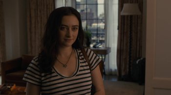 Movie still from “After the Wedding” (2019), directed by Bart Freundlich – A woman in a striped shirt is standing in front of a window; Close Up shot, Over the shoulder angle