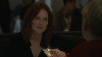 Movie still from “After the Wedding” (2019), directed by Bart Freundlich – A person holding a drink in a glass; Close Up shot, Over the shoulder angle