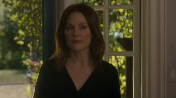 Movie still from “After the Wedding” (2019), directed by Bart Freundlich – A person with long hair; Close Up shot, Over the shoulder angle