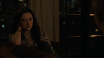 Movie still from “After the Wedding” (2019), directed by Bart Freundlich – A woman sitting on a chair in a dark room; Medium shot, High angle