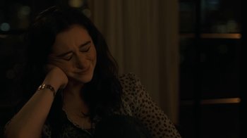 Movie still from “After the Wedding” (2019), directed by Bart Freundlich – A woman sitting in a chair with her eyes closed; Close Up shot, High angle