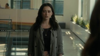 Movie still from “After the Wedding” (2019), directed by Bart Freundlich – A woman standing in a room with a necklace on; Medium shot, Over the shoulder angle