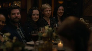 Movie still from “After the Wedding” (2019), directed by Bart Freundlich – A group of women sitting at a table with wine glasses; Medium shot, Over the shoulder angle