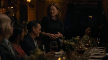Movie still from “After the Wedding” (2019), directed by Bart Freundlich – A man and a woman standing at a dinner table; Medium shot, Over the shoulder angle