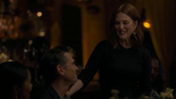 Movie still from “After the Wedding” (2019), directed by Bart Freundlich – A man and a woman are smiling at each other; Medium shot, Over the shoulder angle