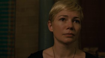 Movie still from “After the Wedding” (2019), directed by Bart Freundlich – A person with short blonde hair; Close Up shot, Over the shoulder angle