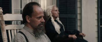 Movie still from “Alice” (2022), directed by Krystin Ver Linden – A man and a woman sitting next to each other; Close Up shot, Over the shoulder angle