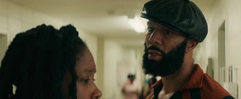 Movie still from “Alice” (2022), directed by Krystin Ver Linden – A man with a beard talking to a woman with long black hair; Close Up shot, Over the shoulder angle