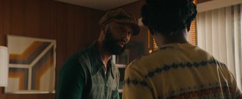 Movie still from “Alice” (2022), directed by Krystin Ver Linden – A man with a beard talking to a woman in a hat; Medium shot, Over the shoulder angle