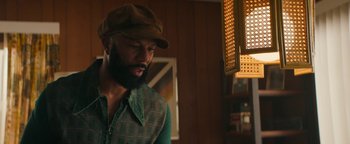 Movie still from “Alice” (2022), directed by Krystin Ver Linden – A man with a beard and a hat is looking at the camera; Medium shot, Over the shoulder angle