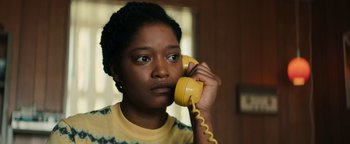 Movie still from “Alice” (2022), directed by Krystin Ver Linden – A woman holding a phone to her ear; Close Up shot, Low angle