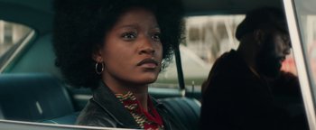 Movie still from “Alice” (2022), directed by Krystin Ver Linden – A woman sitting in the back seat of a car; Close Up shot, Low angle