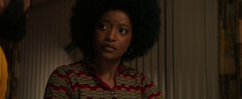 Movie still from “Alice” (2022), directed by Krystin Ver Linden – A person wearing a shirt; Close Up shot, Over the shoulder angle