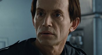 Movie still from “Aliens” (1986), directed by James Cameron – A man's face in a room; Close Up shot, Over the shoulder angle