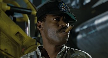 Movie still from “Aliens” (1986), directed by James Cameron – A man with a hat and a cigar in his mouth; Close Up shot, Low angle
