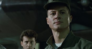 Movie still from “Aliens” (1986), directed by James Cameron – A man wearing a hat and a jacket; Close Up shot, Low angle