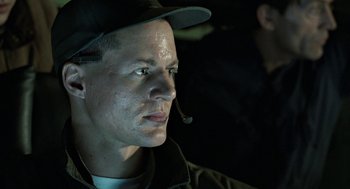 Movie still from “Aliens” (1986), directed by James Cameron – A person wearing a hat; Close Up shot, Low angle