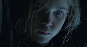 Movie still from “Aliens” (1986), directed by James Cameron – A young person's face with long hair; Close Up shot, Low angle