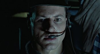 Movie still from “Aliens” (1986), directed by James Cameron – A person wearing a headset; Close Up shot, Low angle