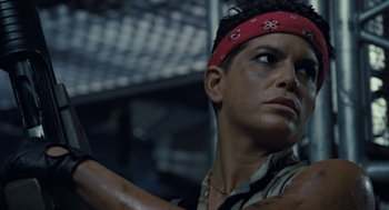 Movie still from “Aliens” (1986), directed by James Cameron – A person with a bandanna on; Close Up shot, Low angle