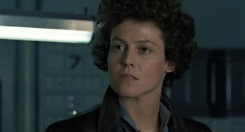 Movie still from “Aliens” (1986), directed by James Cameron – A person with curly hair; Close Up shot, Low angle