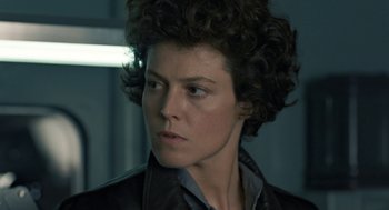Movie still from “Aliens” (1986), directed by James Cameron – A person wearing a leather jacket; Close Up shot, Low angle