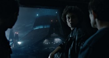 Movie still from “Aliens” (1986), directed by James Cameron – A man standing in front of an alien ship; Wide shot, Low angle