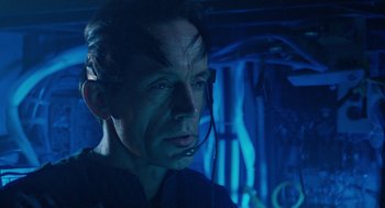 Movie still from “Aliens” (1986), directed by James Cameron – A person wearing a headset; Close Up shot, High angle