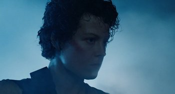 Movie still from “Aliens” (1986), directed by James Cameron – A person with curly hair; Close Up shot, Low angle