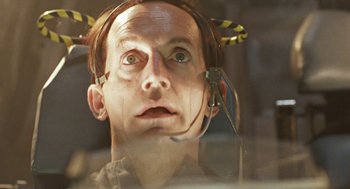 Movie still from “Aliens” (1986), directed by James Cameron – A man wearing a headset looking up at the sky; Close Up shot, Low angle