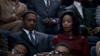 Movie still from “All the Way” (2016), directed by Jay Roach – A man and a woman sitting next to each other; Medium shot, High angle