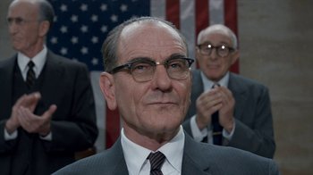 Movie still from “All the Way” (2016), directed by Jay Roach – A man in a suit and tie with glasses; Close Up shot, Low angle