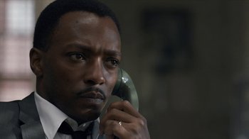 Movie still from “All the Way” (2016), directed by Jay Roach – A person talking on a phone; Close Up shot, Low angle