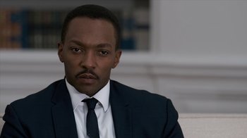Movie still from “All the Way” (2016), directed by Jay Roach – A man wearing a suit and tie sitting in a room; Close Up shot, Over the shoulder angle