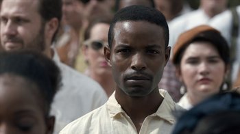 Movie still from “All the Way” (2016), directed by Jay Roach – A person wearing a white shirt; Close Up shot, Over the shoulder angle