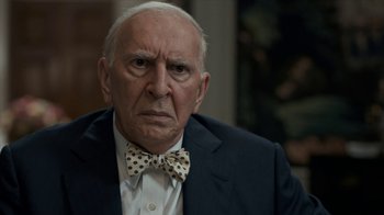 Movie still from “All the Way” (2016), directed by Jay Roach – An older man wearing a suit and a bow tie; Close Up shot, Over the shoulder angle