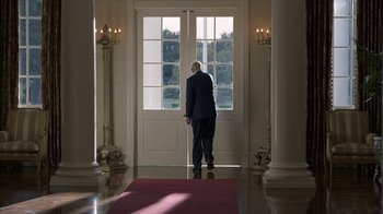 Movie still from “All the Way” (2016), directed by Jay Roach – A man standing in front of a door; Wide shot, Low angle