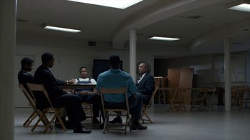 Movie still from “All the Way” (2016), directed by Jay Roach – A group of people sitting around a room; Wide shot, High angle