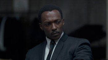 Movie still from “All the Way” (2016), directed by Jay Roach – A man in a suit and tie looking to his left; Close Up shot, Over the shoulder angle