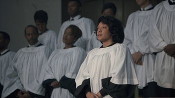 Movie still from “All the Way” (2016), directed by Jay Roach – A group of young people in choir uniforms; Medium shot, High angle