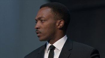 Movie still from “All the Way” (2016), directed by Jay Roach – A man in a suit and tie looking to his left; Close Up shot, Low angle