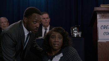 Movie still from “All the Way” (2016), directed by Jay Roach – A man and a woman in front of another man and another man; Medium shot, Over the shoulder angle