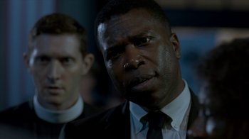 Movie still from “All the Way” (2016), directed by Jay Roach – A man in a suit and tie next to another man in a suit and tie; Close Up shot, Over the shoulder angle