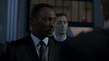 Movie still from “All the Way” (2016), directed by Jay Roach – A man in a suit and tie standing next to another man in a suit; Close Up shot, Over the shoulder angle
