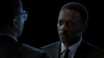 Movie still from “All the Way” (2016), directed by Jay Roach – A person wearing a suit and tie; Close Up shot, Over the shoulder angle