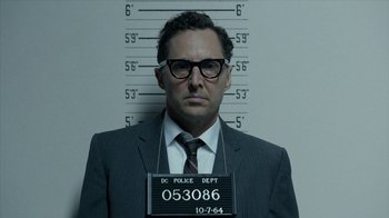 Movie still from “All the Way” (2016), directed by Jay Roach – A man in a suit and tie with glasses; Close Up shot, Low angle