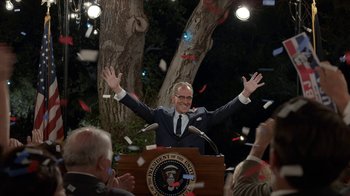 Movie still from “All the Way” (2016), directed by Jay Roach – A man standing at a podium in front of a crowd; Wide shot, Low angle