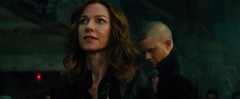 Movie still from “Allegiant” (2016), directed by Robert Schwentke – A man and a woman standing next to each other; Close Up shot, Over the shoulder angle