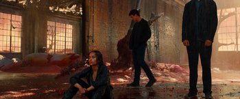 Movie still from “Allegiant” (2016), directed by Robert Schwentke – A man and a woman standing next to each other; Wide shot, High angle